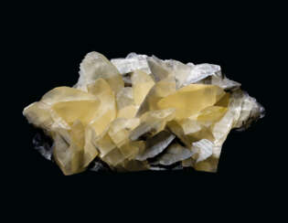 A CLUSTER OF LARGE YELLOW CALCITE CRYSTALS
