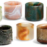 A GROUP OF SEVEN AGATE AND HARDSTONE ARCHER'S RINGS - photo 1