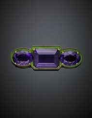 BULGARI | Oval and octagonal amethyst in all ct. 84 circa with green enamel yellow gold brooch