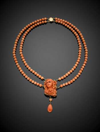Two strand pink orangish coral bead necklace with carved coral cameo central and drop pendant - фото 1