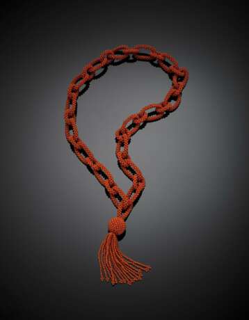 Interwoven orange coral necklace in the centre a pendant tassel - фото 1