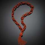 Interwoven orange coral necklace in the centre a pendant tassel - Foto 1
