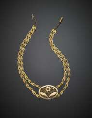 Two strand yellow gold necklace with central floral medallion