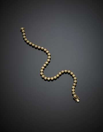 Yellow gold tennis bracelet - photo 1