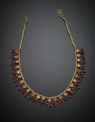 Yellow gold necklace with pink foiled cabochon stones and pendant spinel beads