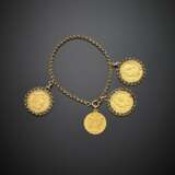 Yellow gold chain bracelet with three coin and one medal as charms - photo 1