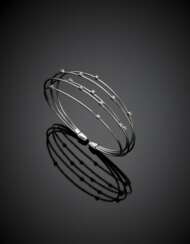 Five wire strand white gold cuff bracelet accented with diamonds