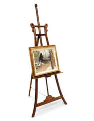 A WOODEN GALLERY EASEL