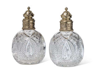 A PAIR OF SILVER-GILT CUT-GLASS SCENT BOTTLES