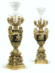 A PAIR OF FRENCH GILT AND PATINATED BRONZE EIGHT-LIGHT CANDELABRA