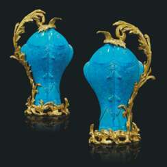 A PAIR OF FRENCH ORMOLU-MOUNTED CHINESE TURQUOISE-GLAZED PORCELAIN TWIN-CARP EWERS