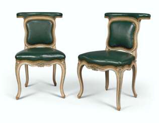 A PAIR OF LOUIS XV GREY AND GREEN-PAINTED CHAISES VOYEUSES