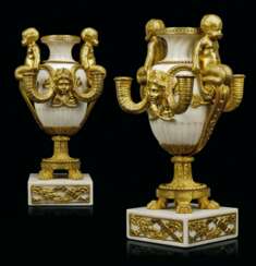 A PAIR FRENCH ORMOLU AND WHITE MARBLE FOUR-LIGHT CANDELABRA 