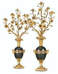A PAIR OF RESTAURATION ORMOLU AND PATINATED-BRONZE FIVE-LIGH...