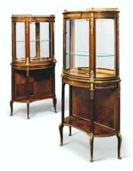 A NEAR PAIR OF FRENCH ORMOLU-MOUNTED MAHOGANY AND BOIS CITRO...