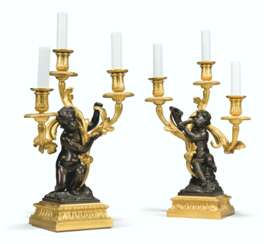 A PAIR OF FRENCH ORMOLU AND PATINATED-BRONZE THREE-LIGHT CAN...