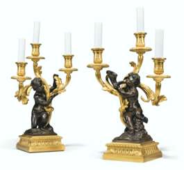 A PAIR OF FRENCH ORMOLU AND PATINATED-BRONZE THREE-LIGHT CAN...