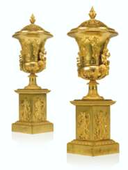 A PAIR OF EMPIRE ORMOLU URNS AND COVERS