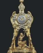 Argenture. A FRENCH 'ORIENTALIST' GILT AND SILVERED-BRONZE MANTLE CLOCK