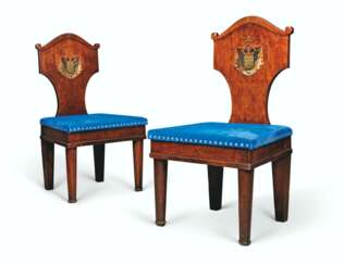 A PAIR OF NORTH EUROPEAN MAHOGANY HALL CHAIRS