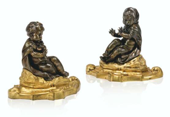 A PAIR OF FRENCH ORMOLU AND PATINATED-BRONZE PRESSE-PAPIERS - photo 1