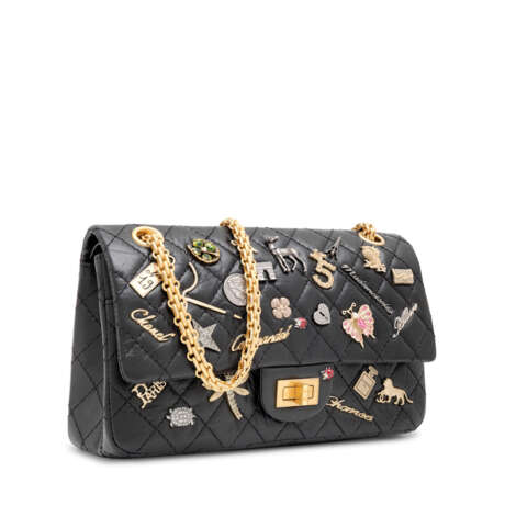 CHANEL. A BLACK AGED CALFSKIN LEATHER LUCKY CHARM 2.55 REISSUE 225 SINGLE FLAP WITH GOLD HARDWARE - photo 2