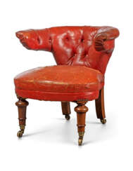 AN EARLY VICTORIAN WALNUT AND RED-LEATHER READING-CHAIR