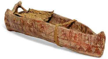 AN EGYPTIAN POTTERY MODEL OF A PAPYRUS BOAT