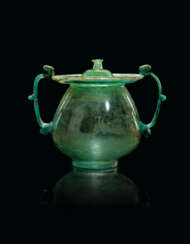 A GALLO-ROMAN BLUE-GREEN BLOWN GLASS CINERARY URN