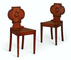 A MATCHED PAIR OF REGENCY MAHOGANY HALL CHAIRS