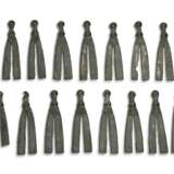 A GROUP OF THIRTY-FOUR BRONZE V-SHAPED HARNESS ORNAMENTS - photo 1