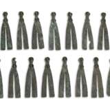 A GROUP OF THIRTY-FOUR BRONZE V-SHAPED HARNESS ORNAMENTS - фото 2