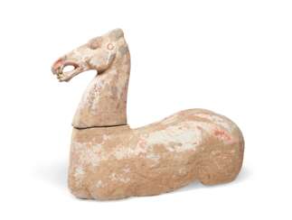 A PAINTED POTTERY FIGURE OF A HORSE