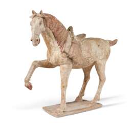 A LARGE PAINTED POTTERY FIGURE OF A HORSE 