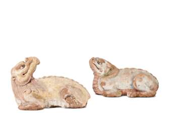 A PAIR OF PAINTED BAKED MUD FIGURES OF MYTHICAL BEASTS