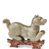 A GREYISH-GREEN CARVED JADE FIGURE OF A DOG - photo 2