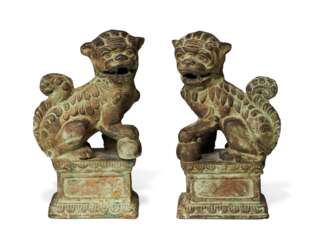 A PAIR OF IRON FIGURES OF BUDDHIST LIONS
