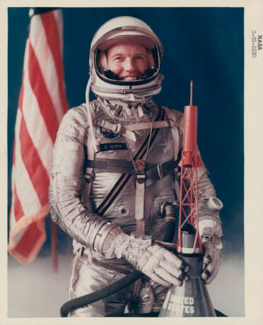 Official portrait of Gordon Cooper; Cooper checking out his spacesuit, Faith 7 spacecraft, flight couch, food, space and photographic equipment, 1962-May 1963 - фото 1