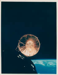 Gemini VII gleaming in the Sun; views of the spacecraft in Earth orbit, December 15-16, 1965