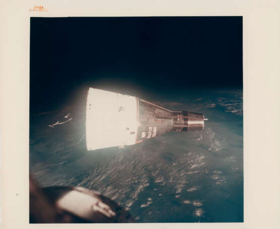 Gemini VII above the cloud-covered Earth; the spacecraft maneuvering over the Earth at dawn, December 15-16, 1965 - photo 4