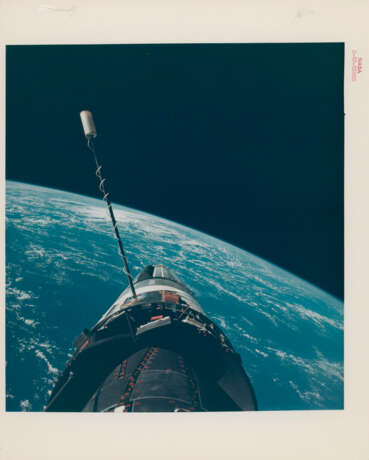 EVA photograph: Gemini XII docked with Agena over the Pacific Ocean; Buzz Aldrin’s stand-up EVA in the open hatch of the spacecraft, November 11-15, 1966 - photo 1