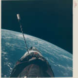 EVA photograph: Gemini XII docked with Agena over the Pacific Ocean; Buzz Aldrin’s stand-up EVA in the open hatch of the spacecraft, November 11-15, 1966 - photo 1