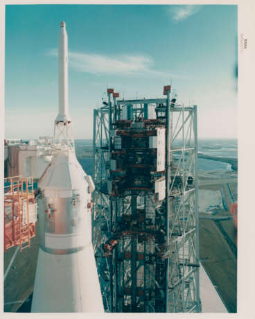 The first rocket to send humans to another world; the mission emblem; close-up of the spacecraft at Pad 39A before launch, December 1968 - фото 5