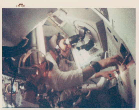 James Lovell in weightlessness during man’s first voyage to another world, December 21-27, 1968 - photo 1