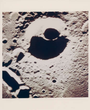 Farside moonscapes first seen by humans: “Keyhole shaped” crater; Crater Tsiolkovsky; brightly-rayed crater, bright crater, December 21-27, 1968 - photo 1