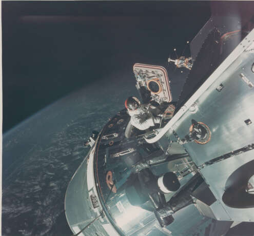 David Scott in the open hatch of the orbiting spacecraft [Large Format] during the first American two-man EVA, March 3-13, 1969 - фото 1