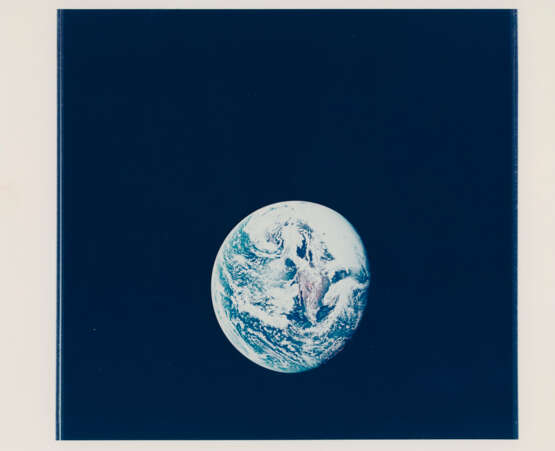 The Planet Earth; the LM Snoopy during the first translunar docking; half of the Earth appearing through the window, May 18-26, 1969 - photo 1