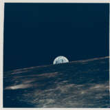 The Earth emerging from behind the rim of the Moon; vertical view of Apollo 11 landing site, May 18-26, 1969 - Foto 1