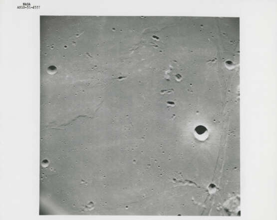 The Earth emerging from behind the rim of the Moon; vertical view of Apollo 11 landing site, May 18-26, 1969 - photo 3
