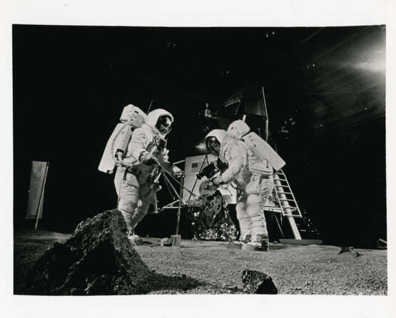 Prelaunch activities: Neil Armstrong taking photographs with the Hasselblad camera and the crew during lunar training, April-July 1969 - фото 1
